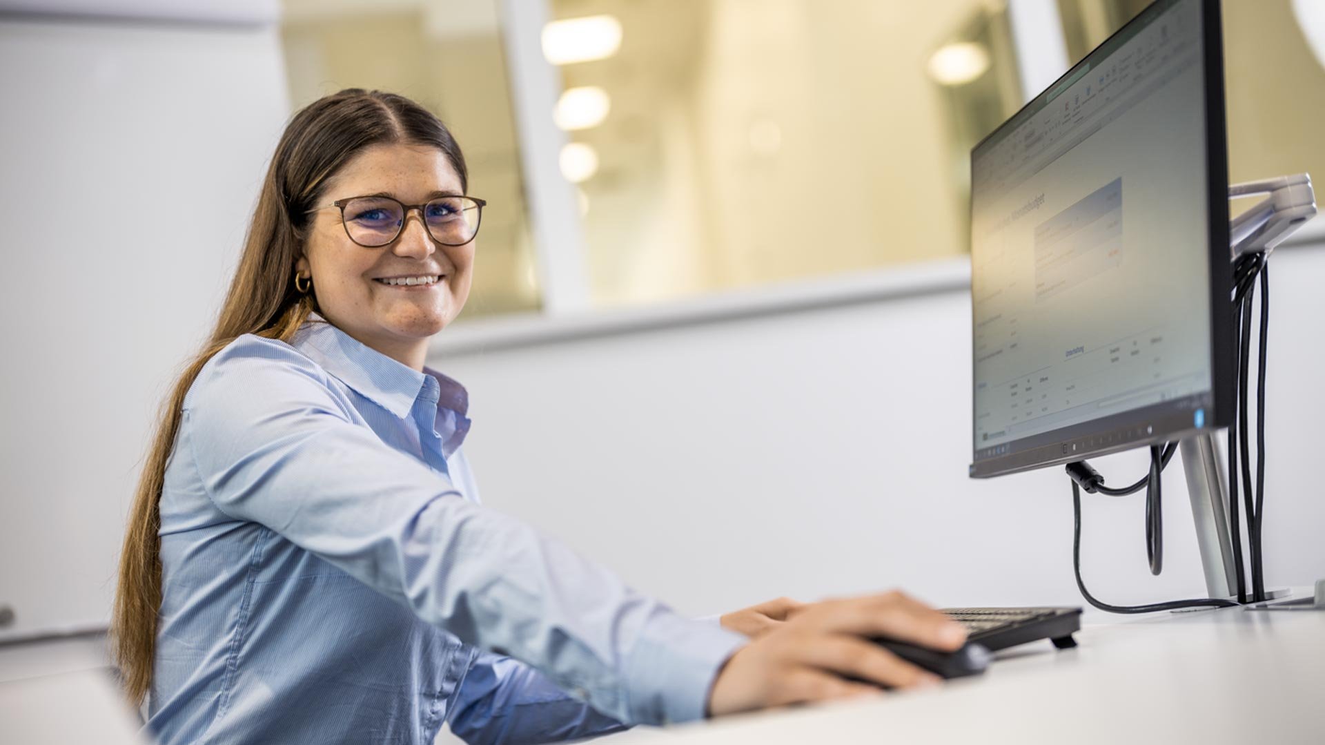 Trainee-industrial-clerk-at-computer